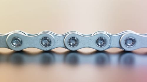 Looping animation of the infinite bike chain. Metallic. Interlocked parts. 4k HD