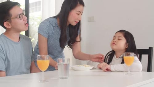 Loving Family Sharing Meal Together at Home