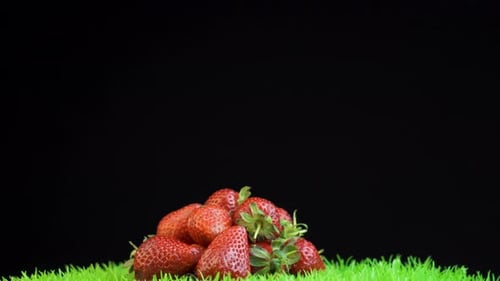 Spinning Cadre of A Pile of Strawberries on A Black Background
