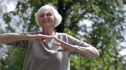 Retired Lady Exercising in Park
