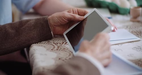 Senior Adult Using Digital Tablet Technology Close Up