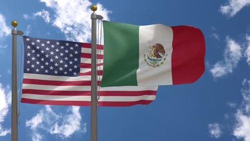 United States and Mexico Flags Waving Realistically in Blue Sky