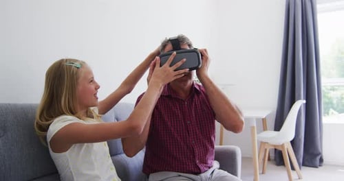 Child Helps Adult With Virtual Reality Headset