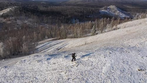 Lonely Traveler Climbs to the Top of the Mountain Range