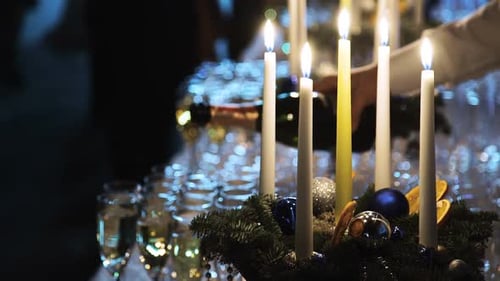 Champagne Pouring at Festive Event with Candles