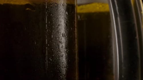 Icy Mugs of Golden Beer Close Up