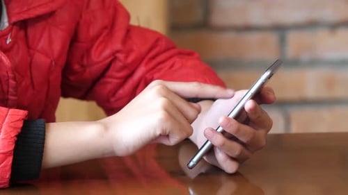 Woman Using Smartphone with Hands in Close Up