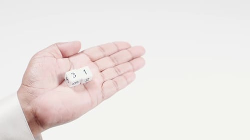 Hand Holds Numbered Dice Three And One Thirty One