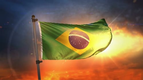 Waving Flag of Brazil Against Stunning Sunset Sky