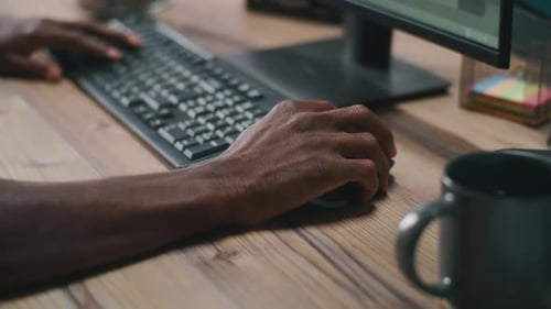 Crop Black Guy Using Computer