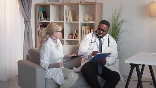 Two Doctors Discussing X-Ray in a Home Office