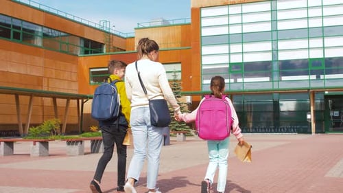 Mother with Son and Daughter Going To School