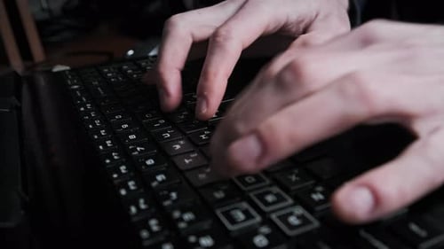 Typing Text on Laptop Keyboard Men Hands Press the Black Keys of Laptop