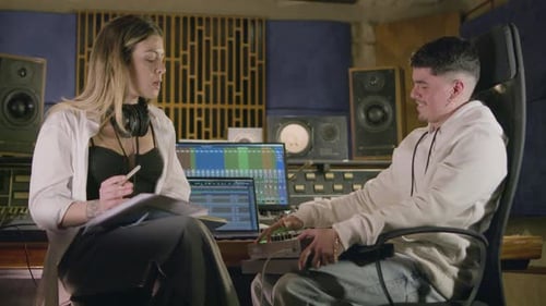 Two Talented Musicians Working at Music Recording Studio