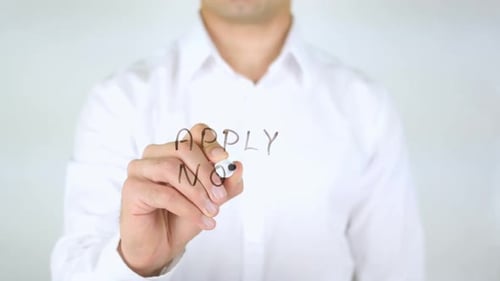 Hand Writes 'Apply Now' Message