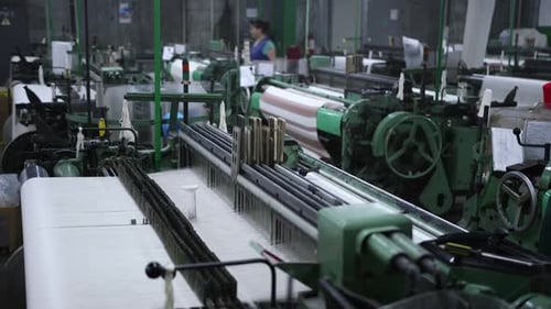 Textile Machines Operating inside Manufacturing Factory