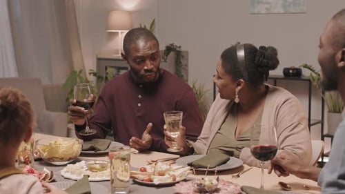 Happy Family Having Dinner Together at Home