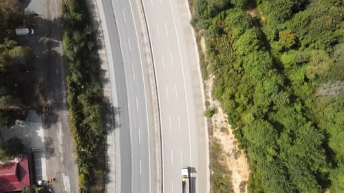 Aerial View of the Two Sides of a Highway Surrounded