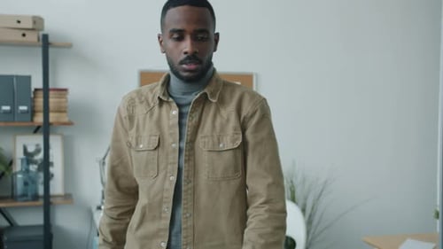 Slow Motion of African American Businessman Walking in Office Greeting Colleagues Then Working with