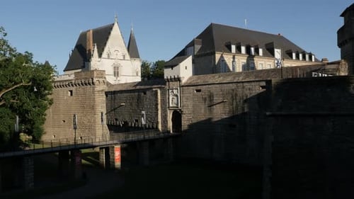 NANTES, FRANCE - JULY 2016 Ramparts and towers of castle of the Dukes of Brittany by the summer d