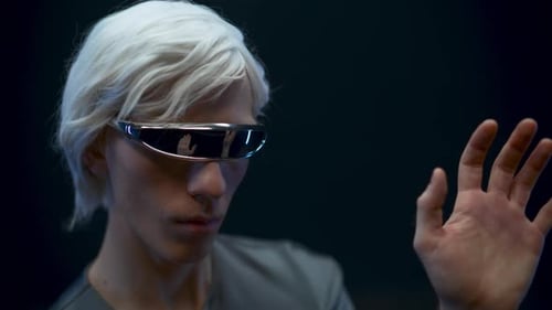 Person with White Hair Gesturing in a Futuristic Setting