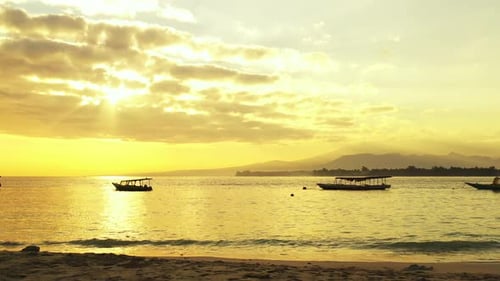 Daytime flying clean view of a sandy white paradise beach and aqua blue ocean background in high res