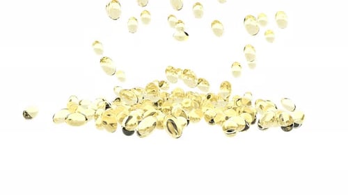 Golden Oil Capsules Falling and Piling Up Animation
