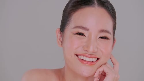 Woman Posing with Natural Makeup and Radiant Smile