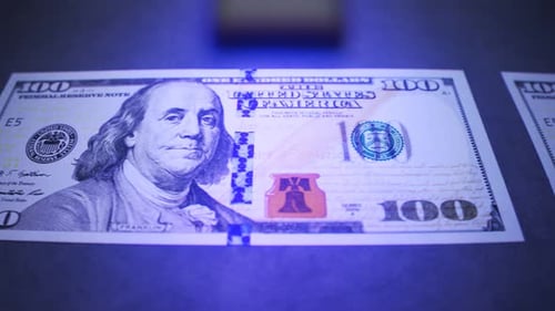 UV Light Scan Verifies Authenticity of Hundred Dollar Bill