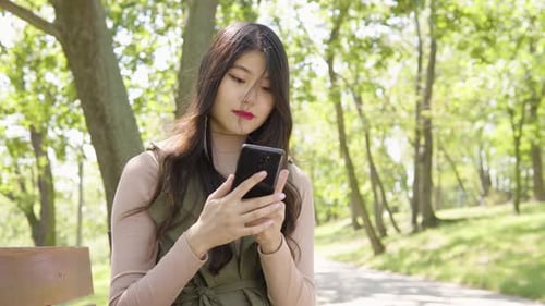 Young Asian Woman Takes Selfies Smile As She Sits Bench Park Sunny Day