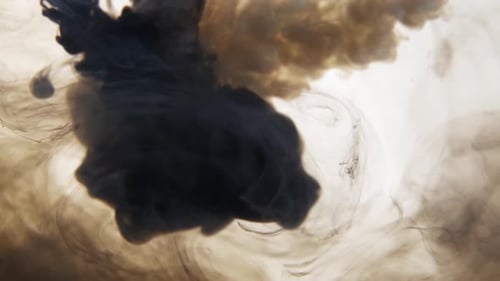 Swirling Black Ink Flowing into Clear Water