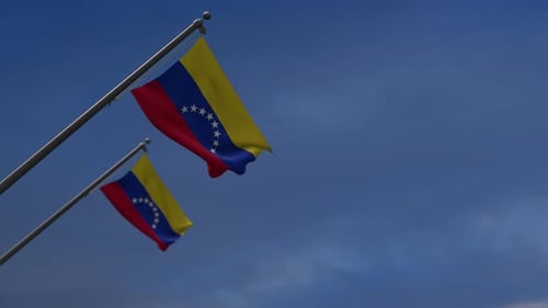 Venezuelan Flag Waving Against Blue Sky