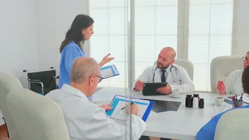 Medical Team Meeting in Modern Office