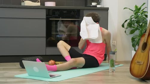 Man Cooling Down after Home Workout