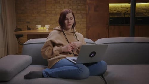 Woman Talking on Laptop Video Conference Call