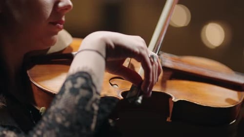 Female Violinist is Playing Violin in Music School Closeup of Fiddle in Hands of Woman