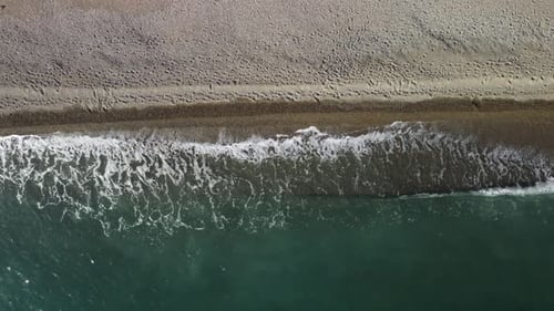 Aerial View From Above on Calm Azure Sea and Volcanic Rocky Shores