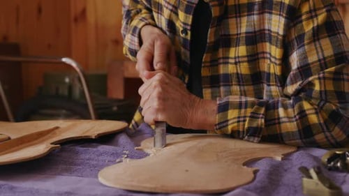 Female luthier at work in her workshop