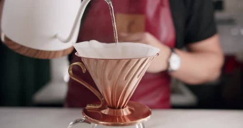 Pouring Water into a Coffee Filter