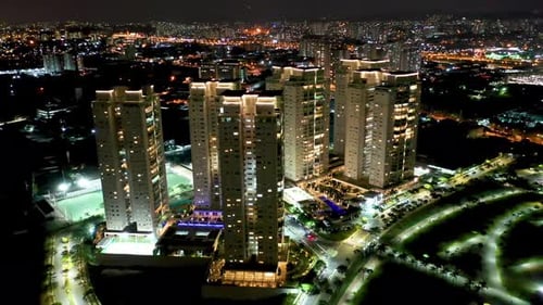 Night city landscape at downtown district. Buildings and traffic.