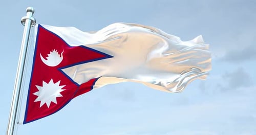 Realistic Waving Flag of Nepal Against Blue Sky