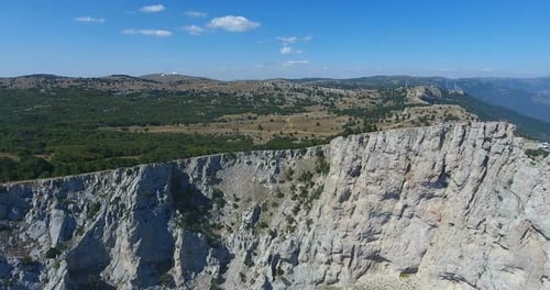 Drone Shot Flying Close To a Huge Rock Cliff. Aerial View on Crimea Landscape with Cliffs and