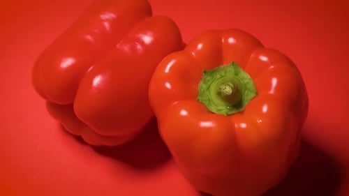 Juicy Shiny Bell Pepper on a Red Background