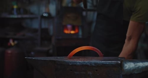 Blacksmith is Forging Hot Metal Detail on Anvil Use Big Hammer Closeup View Prores