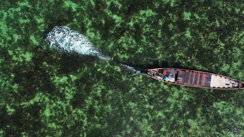 Daytime fly over island view of a paradise sunny white sand beach and aqua turquoise water backgroun