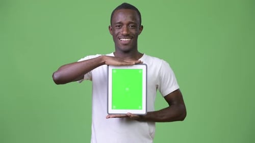 Man Holds Tablet with Chroma Key Green Screen