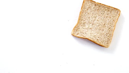 Slice of Bread on White Surface
