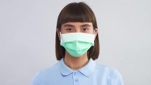 Young Adult Woman Wearing a Face Mask