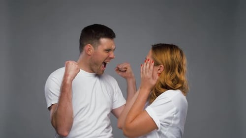 Excited Couple Celebrating Success Together