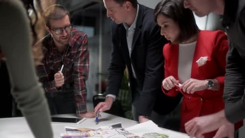 Architects Team Are Working On Paper Blueprint. Business Woman Suggest Idea To Designer. Concept Of
